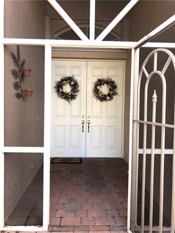 9008 Springview Loop Estero, FL 33928 - Photo 3 of 11 Paver stone entrance with lovely double doors