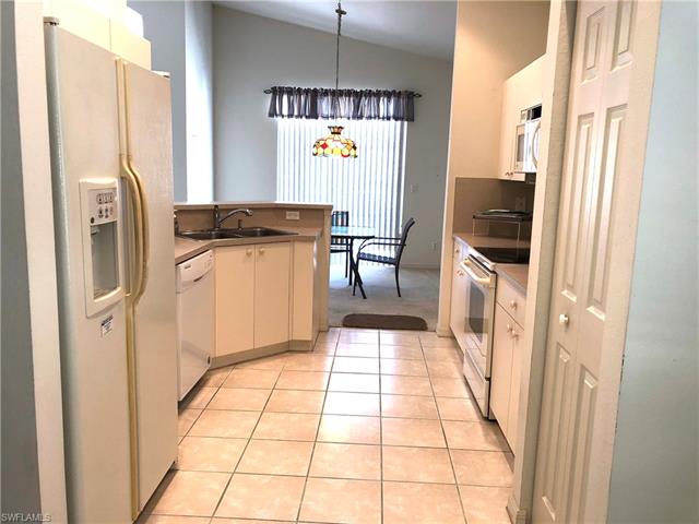 9008 Springview Loop Estero, FL 33928 - Photo 5 of 11 Nice kitchen with stainless steel sink and new faucets. Pantry.
