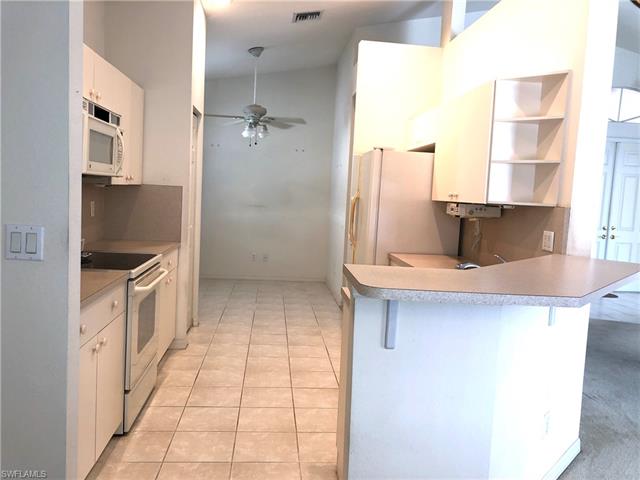 9008 Springview Loop Estero, FL 33928 - Photo 6 of 11 Breakfast bar in kitchen