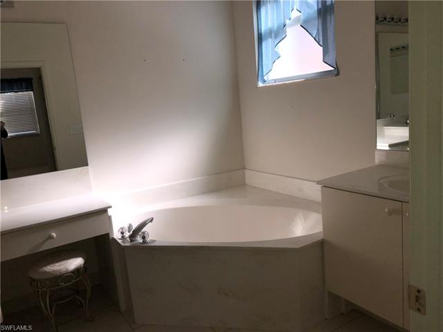 9008 Springview Loop Estero, FL 33928 - Photo 8 of 11 Master bath has soaking tub, double sinks, separate shower and vanity