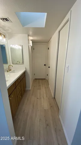 a bathroom with a sink a mirror and a toilet