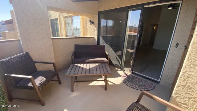 a view of a hallway with seating area