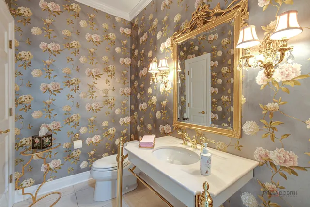 a living room with furniture and floor to ceiling windows