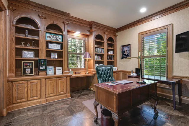 a bathroom with a toilet a sink a vanity and mirror