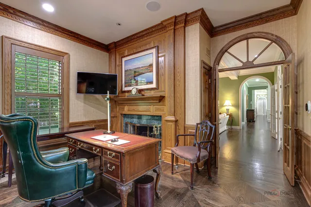 a view of living room with furniture and a fireplace