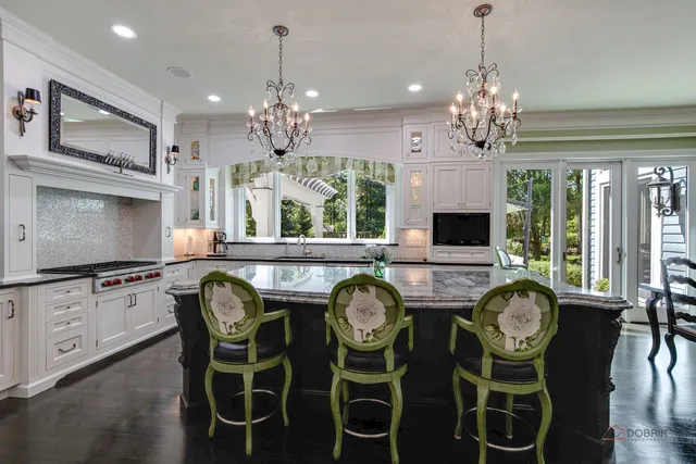 a view of a livingroom with furniture chandelier and a window