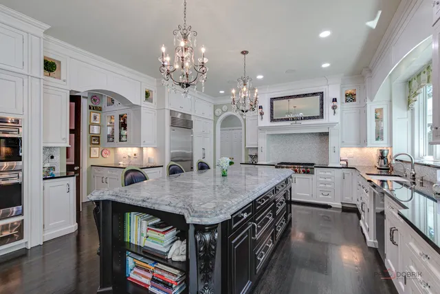a bathroom with a granite countertop toilet a sink and a mirror