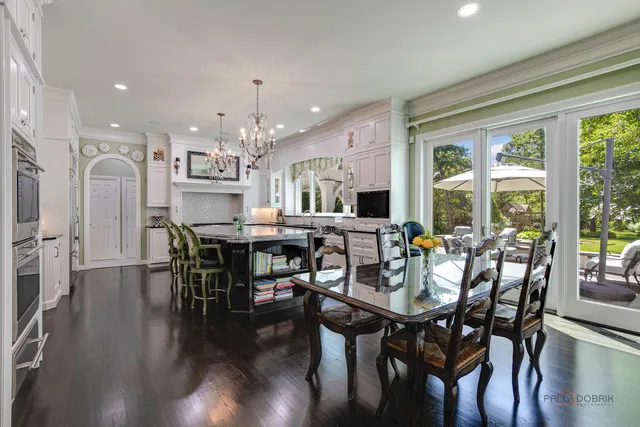 a living room with furniture and a book shelf
