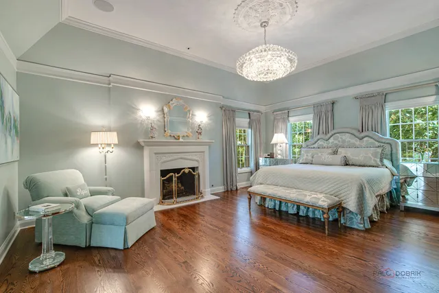 a view of a dining room with furniture wooden floor and chandelier