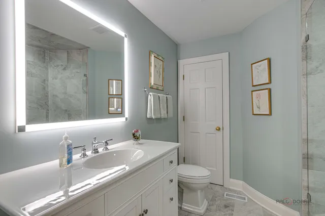 a front view of a house with a yard table and chairs