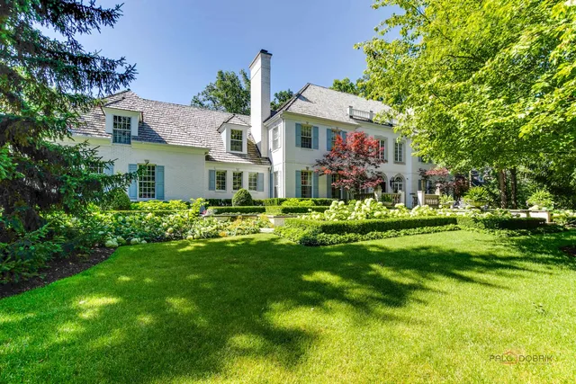 a bathroom with a sink and mirror with toilet