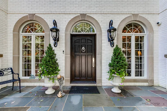 a living room with furniture a fireplace and a window