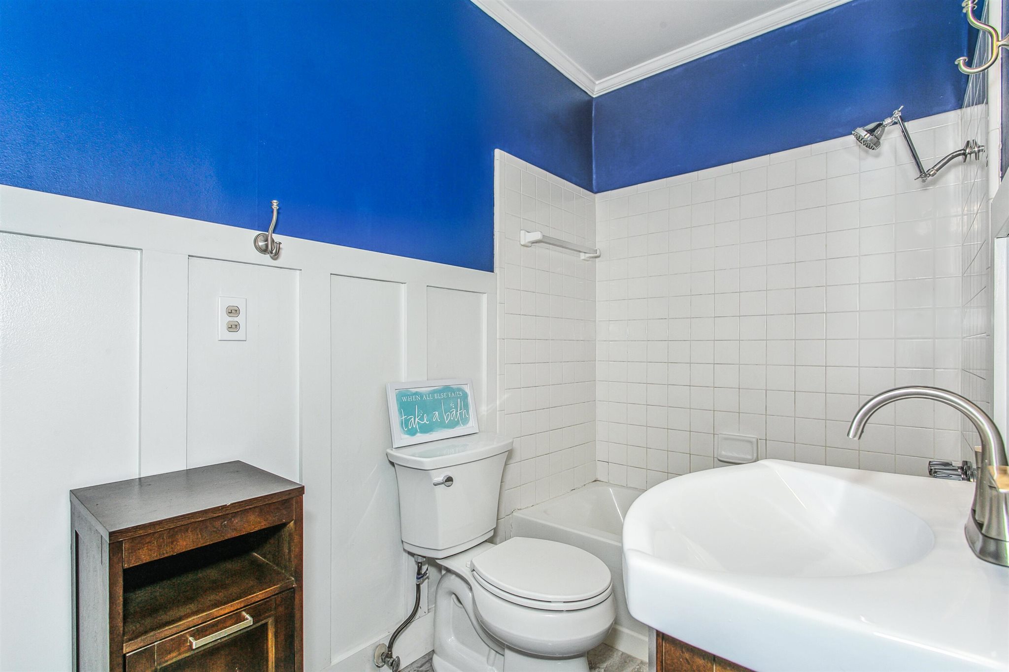 5926 Saufley Pines Road Pensacola, FL 32526 - Photo 15 of 35 a bathroom with a sink a toilet and a mirror