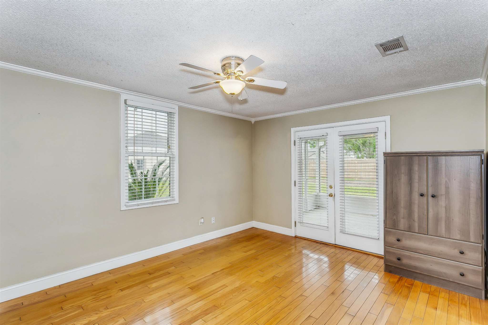 5926 Saufley Pines Road Pensacola, FL 32526 - Photo 19 of 35 wooden floor in an empty room with a window