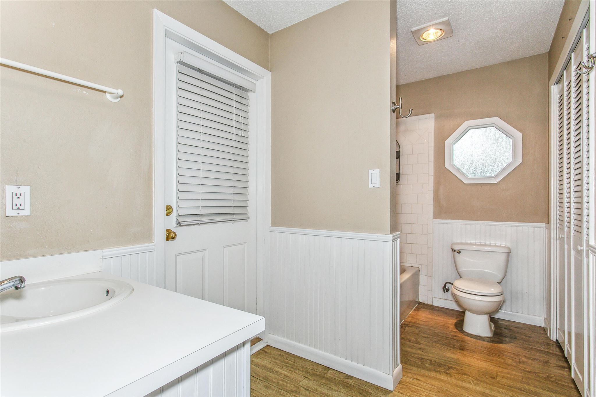 5926 Saufley Pines Road Pensacola, FL 32526 - Photo 21 of 35 a bathroom with a sink a toilet and a large mirror