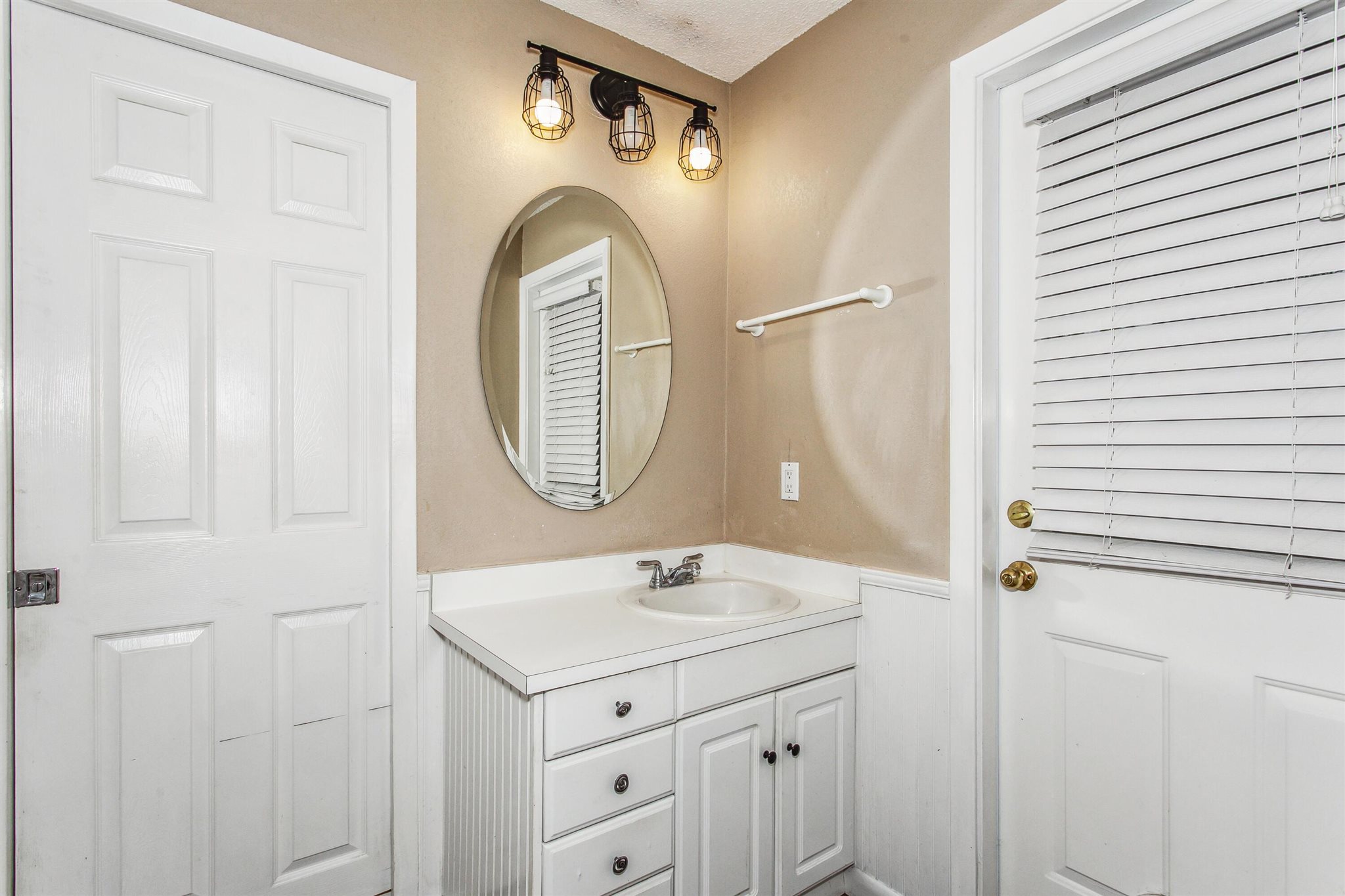 5926 Saufley Pines Road Pensacola, FL 32526 - Photo 23 of 35 a bathroom with a sink a mirror and a shower curtain