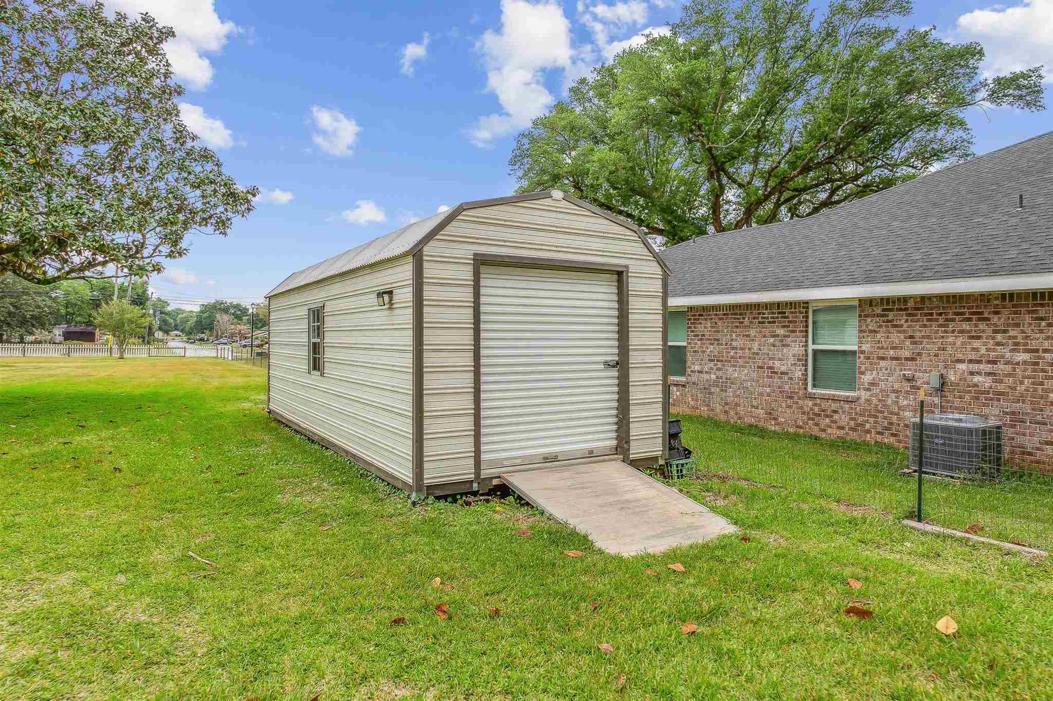 5926 Saufley Pines Road Pensacola, FL 32526 - Photo 34 of 35 a view of a backyard with a small cabin