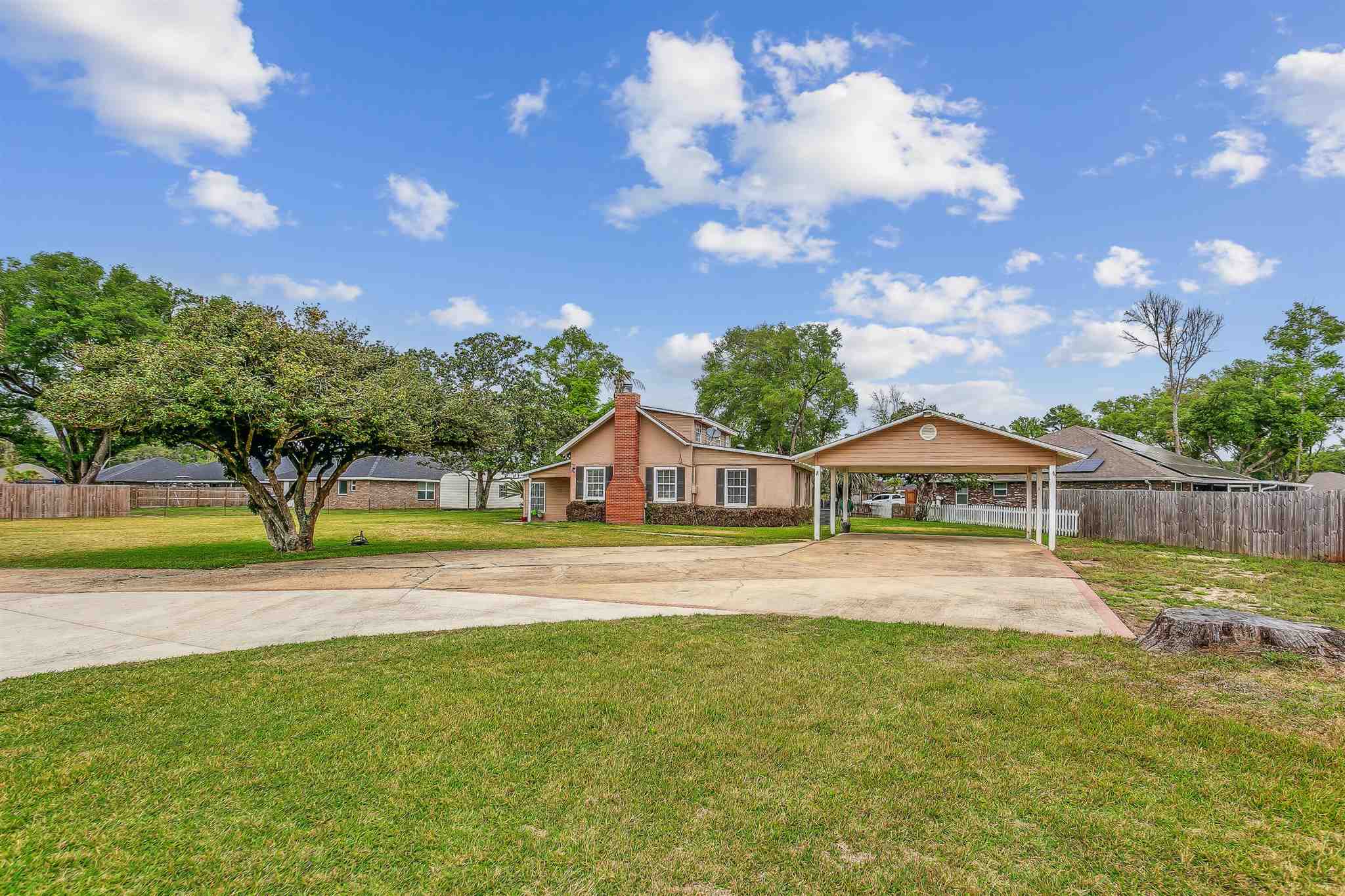 5926 Saufley Pines Road Pensacola, FL 32526 - Photo 35 of 35 a view of a house with a big yard and large trees
