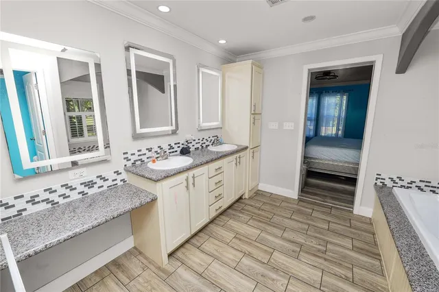 a bathroom with bathtub and a shower