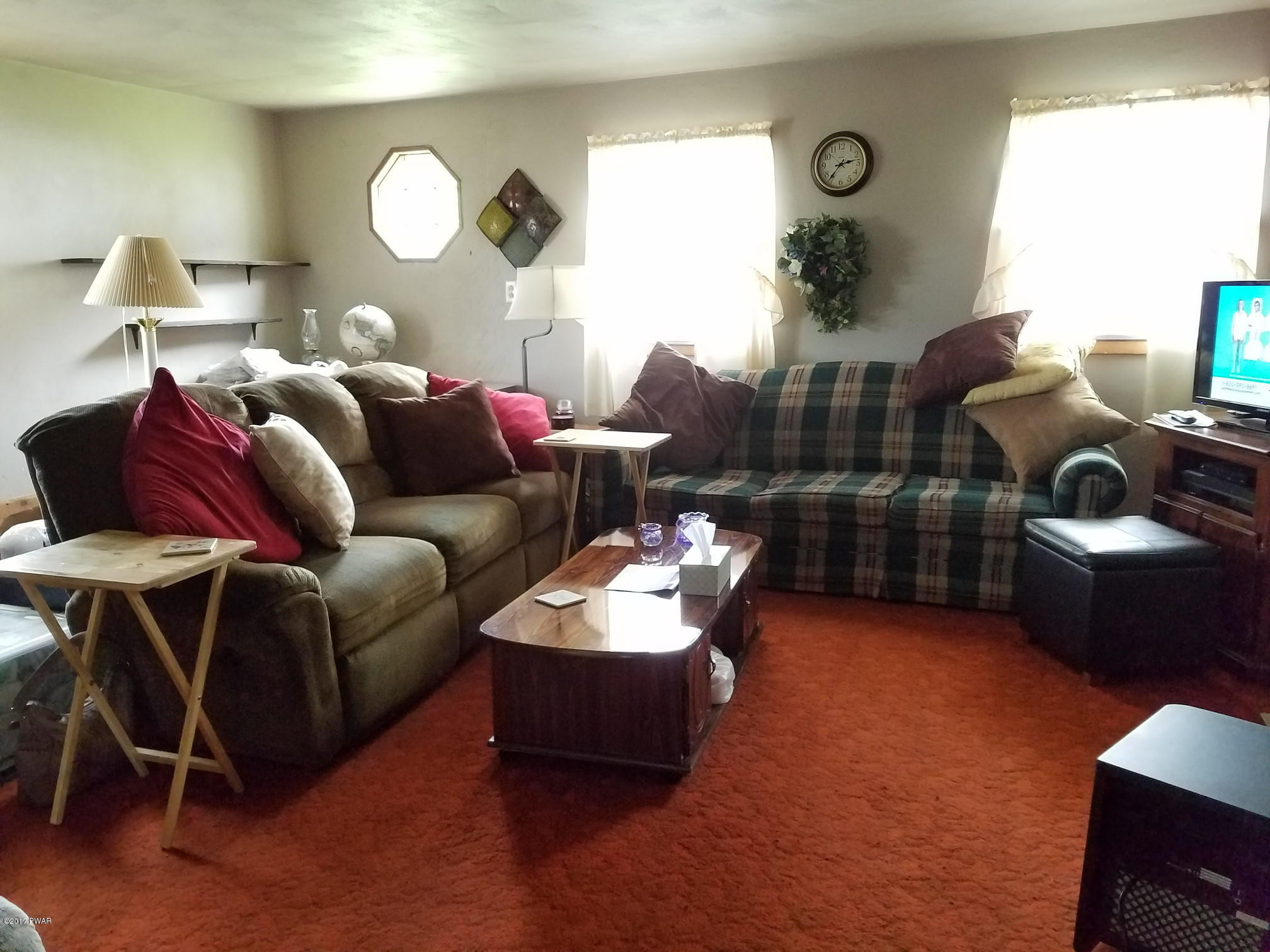 80 Fox Farm Road Windsor, NY 13865 - Photo 2 of 14 a living room with furniture and a lamp
