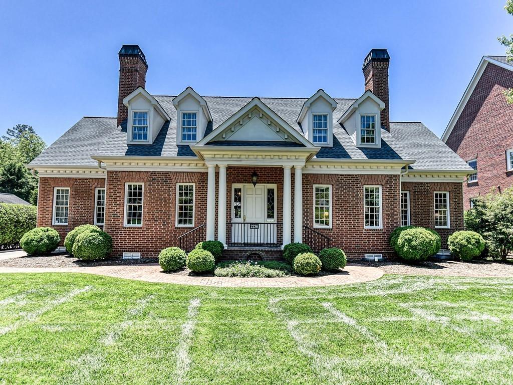 2236 Overhill Road Charlotte, NC 28211 - Photo 1 of 48 a front view of a house with garden