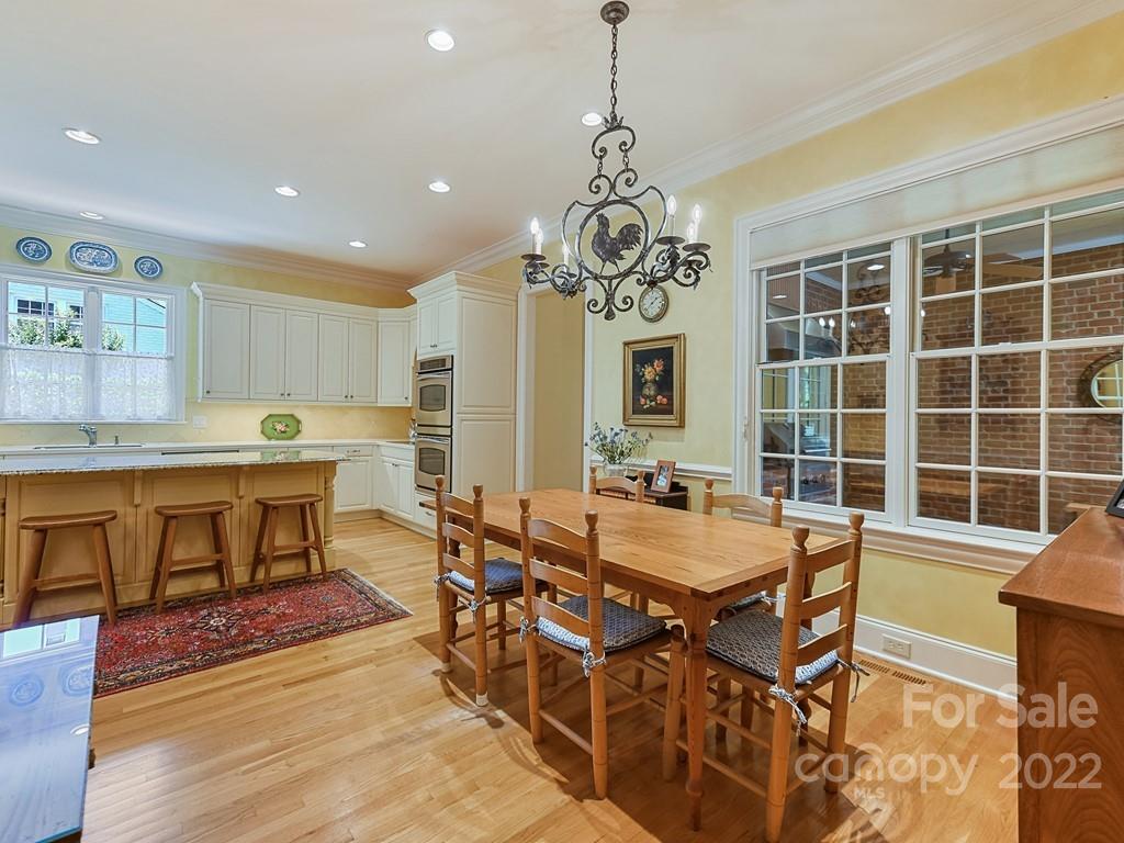2236 Overhill Road Charlotte, NC 28211 - Photo 14 of 48 a view of a dining room with furniture window and wooden floor