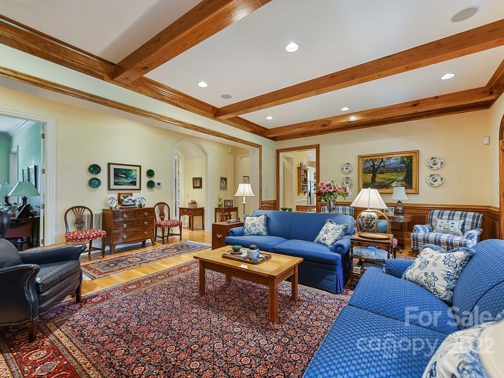 2236 Overhill Road Charlotte, NC 28211 - Photo 20 of 48 a living room with furniture potted plant and a rug