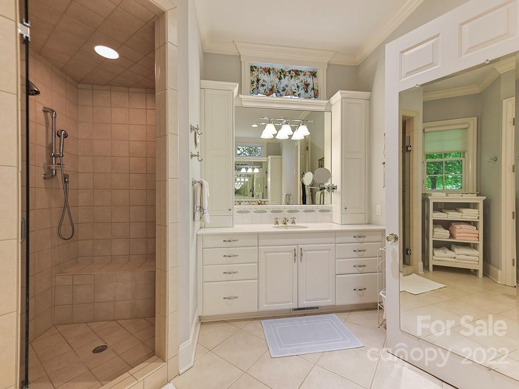 2236 Overhill Road Charlotte, NC 28211 - Photo 23 of 48 a bathroom with a shower a sink and a mirror