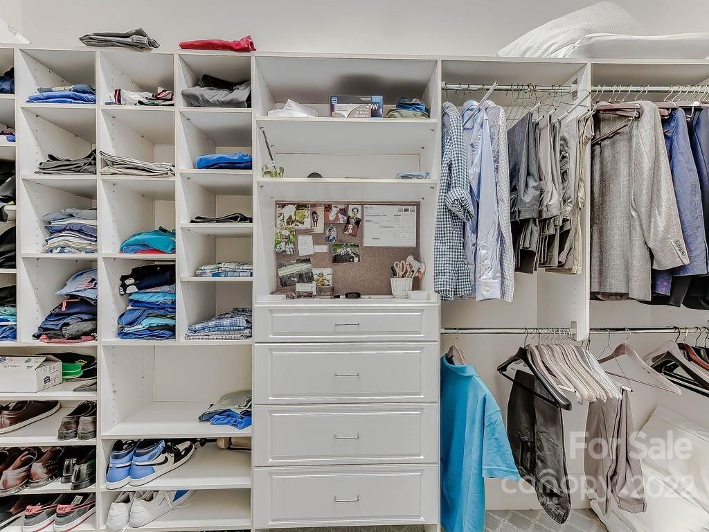2236 Overhill Road Charlotte, NC 28211 - Photo 25 of 48 a view of walk in closet with clothes and shoes
