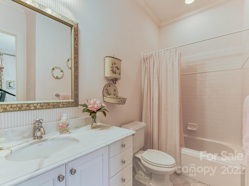 2236 Overhill Road Charlotte, NC 28211 - Photo 27 of 48 a bathroom with a sink a toilet and shower
