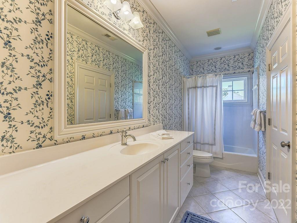 2236 Overhill Road Charlotte, NC 28211 - Photo 31 of 48 a bathroom with a sink and a mirror