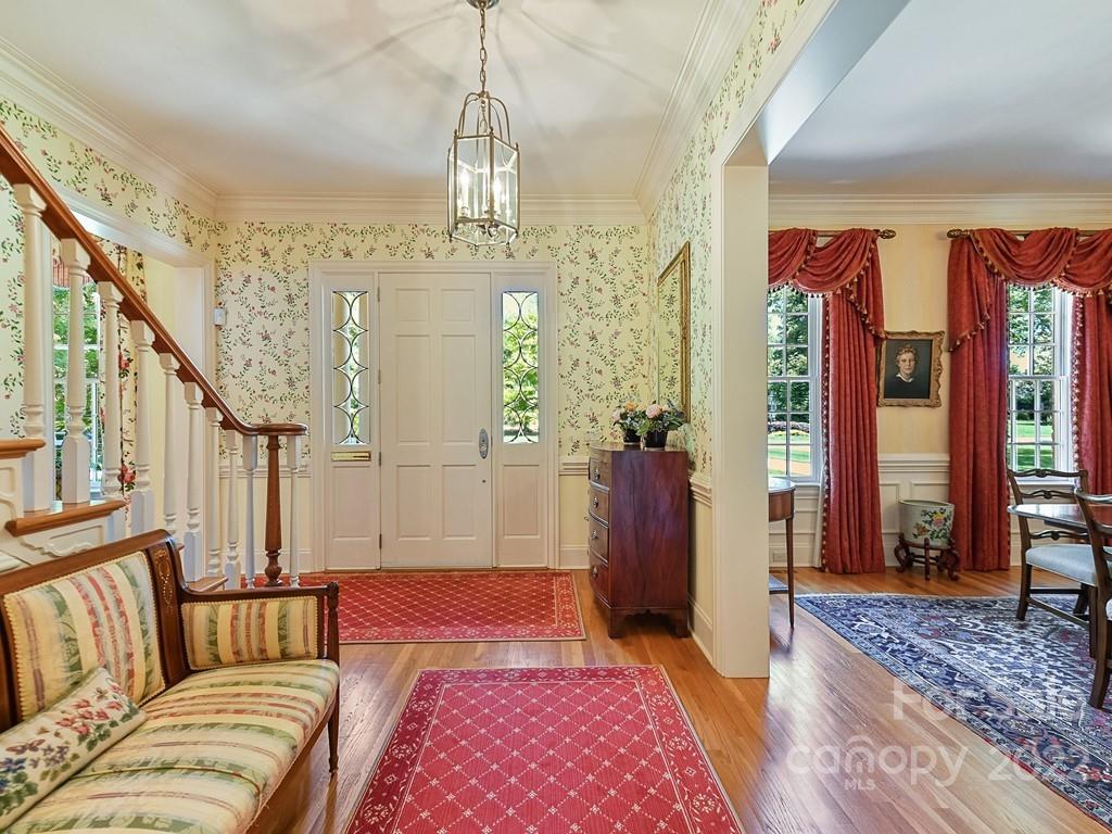 2236 Overhill Road Charlotte, NC 28211 - Photo 4 of 48 a bedroom with furniture and a chandelier
