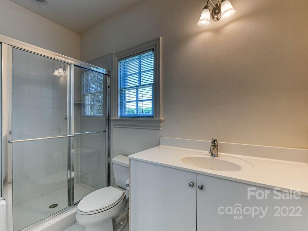 2236 Overhill Road Charlotte, NC 28211 - Photo 43 of 48 a bathroom with a sink mirror toilet and shower
