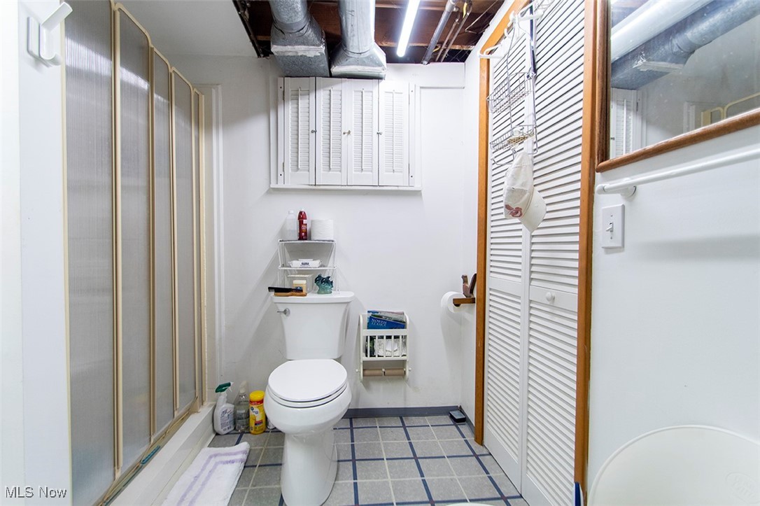 20749 Albion Road Strongsville, OH 44149 - Photo 28 of 35 Bathroom featuring tile patterned flooring, toilet, baseboards, and walk in shower