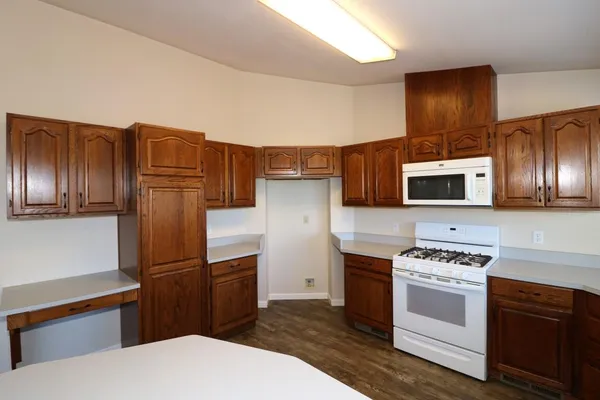 a kitchen with stainless steel appliances a refrigerator stove and sink