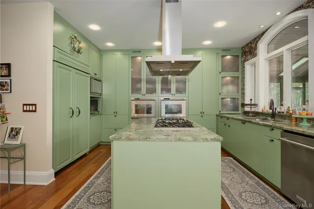 a kitchen with a sink and a refrigerator
