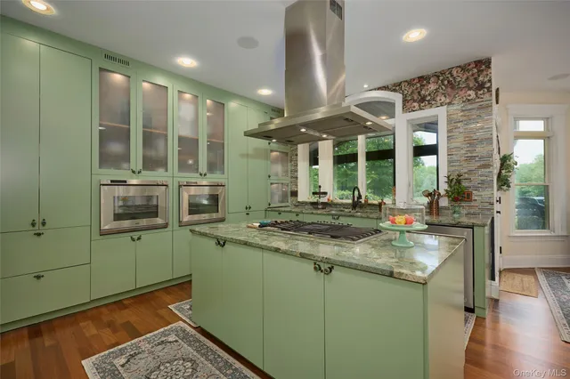 a kitchen with a sink and a large window