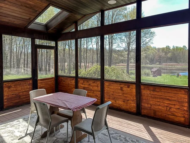 a view of a patio with a table chairs and a table
