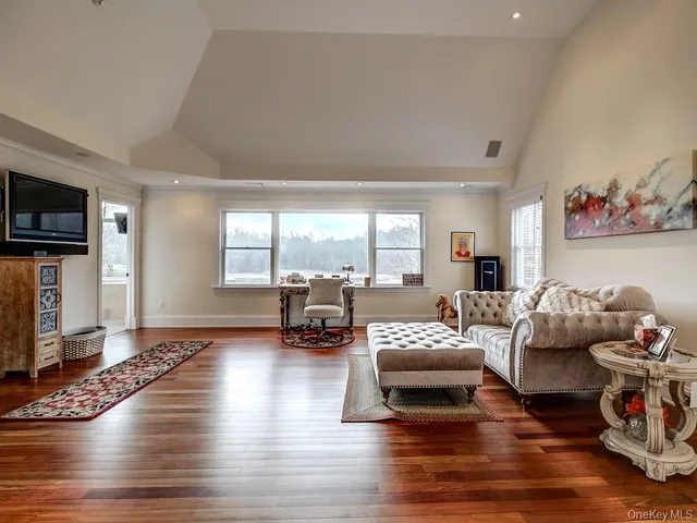 a living room with furniture or couch and a flat screen tv