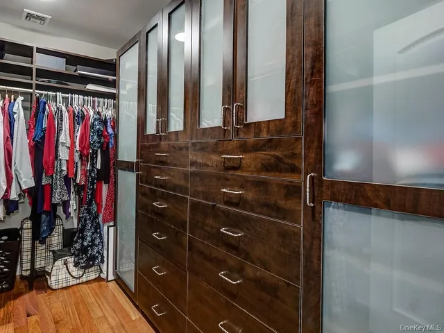 a bed room with a bed and a chair