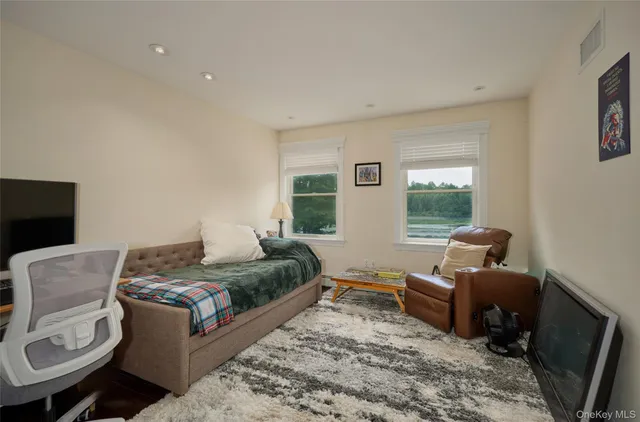 a living room filled with furniture and a rug