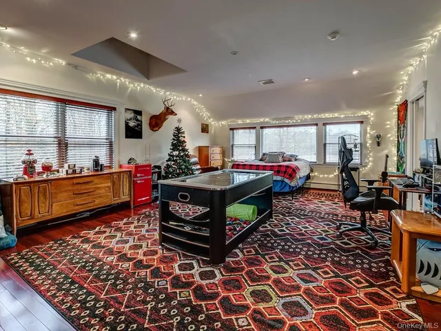 a bedroom with a bed and a mirror