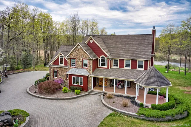 a view of a swimming pool with a yard