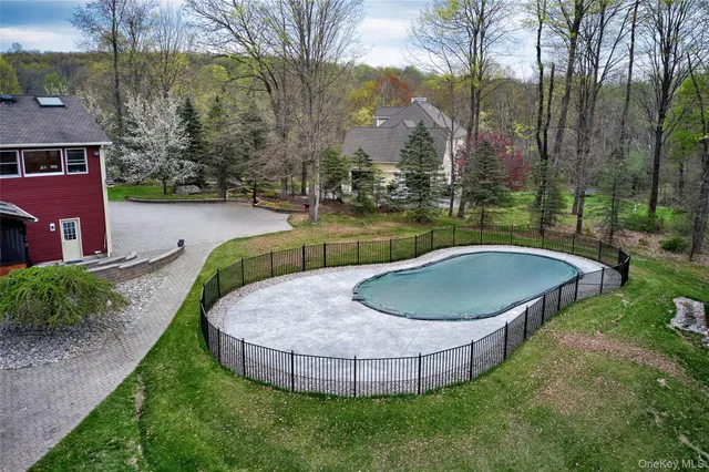 a view of a garden with large trees