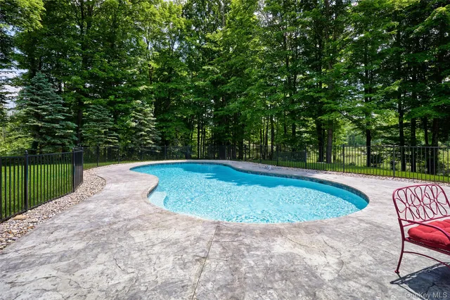 a view of a swimming pool with a patio