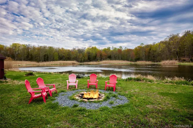 a view of a lake with outdoor seating