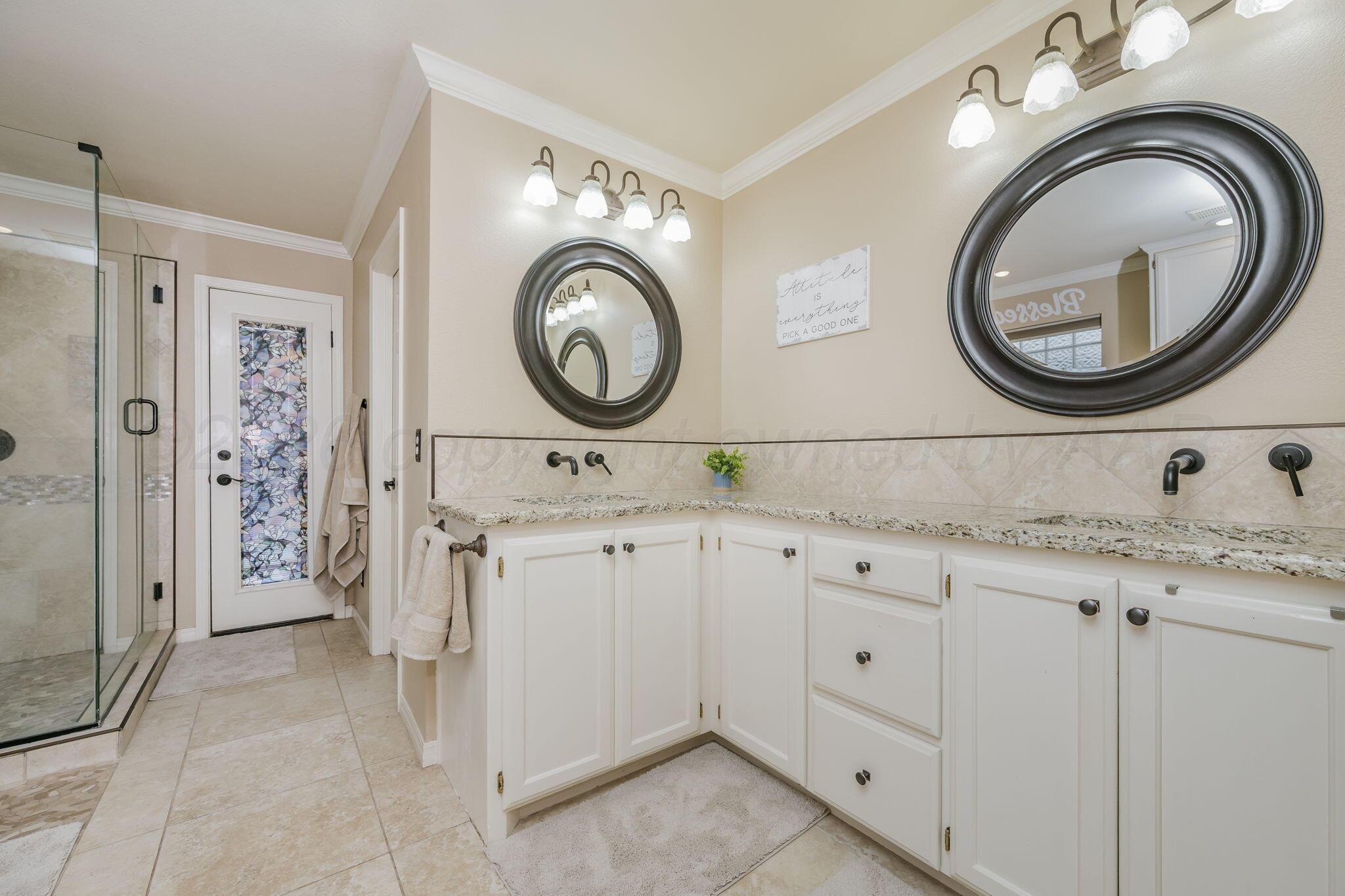 15812 Outback Trail Amarillo, TX 79118 - Photo 16 of 25 a bathroom with a granite countertop sink and a mirror