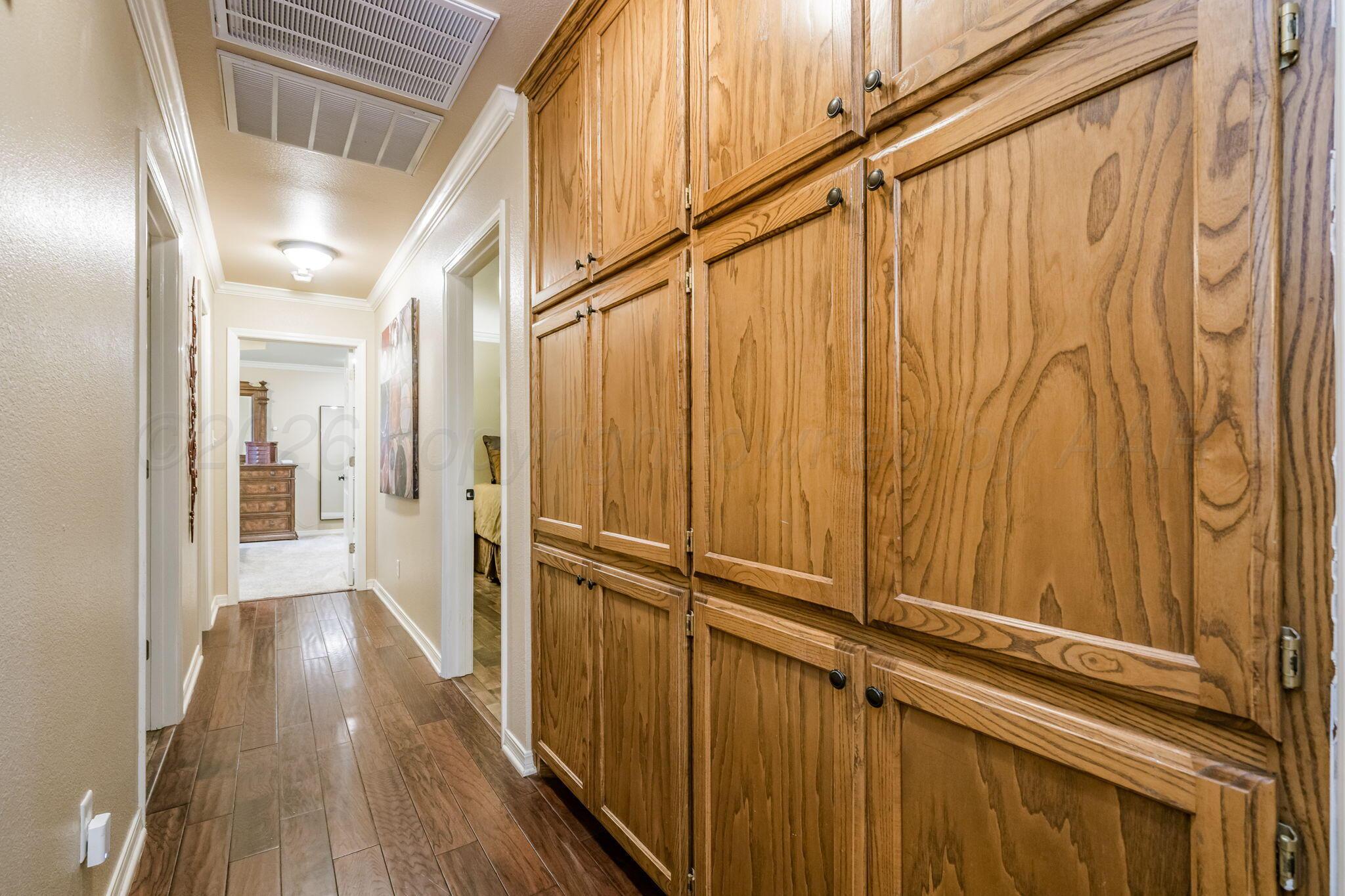 15812 Outback Trail Amarillo, TX 79118 - Photo 18 of 25 a view of a hallway with wooden floor and staircase