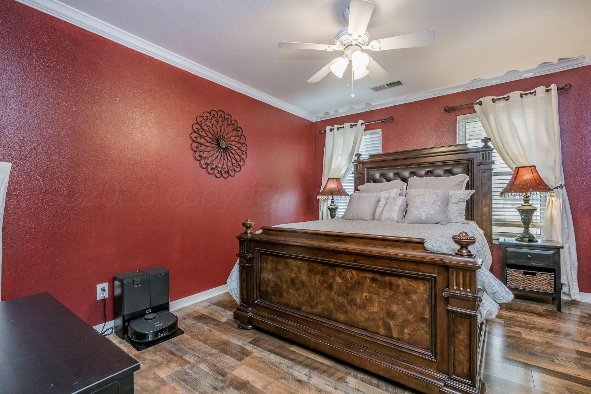 15812 Outback Trail Amarillo, TX 79118 - Photo 19 of 25 a bed sitting in a room next to a window