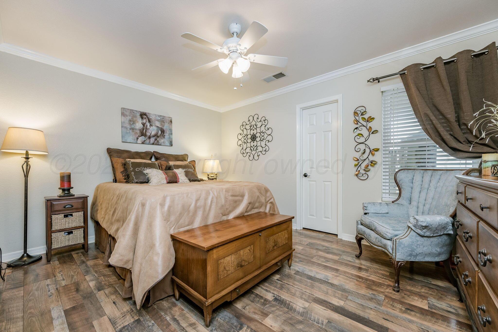 15812 Outback Trail Amarillo, TX 79118 - Photo 21 of 25 a bedroom with a bed and a chair